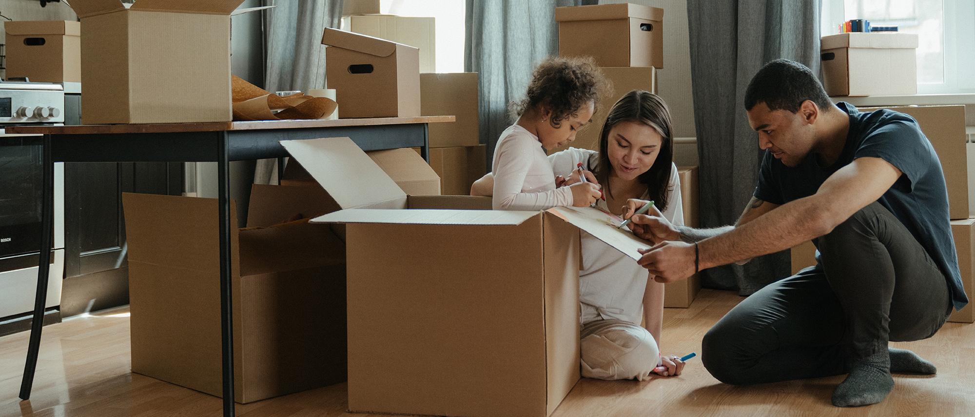 Family unpacking boxes