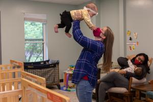 Kelly holding child